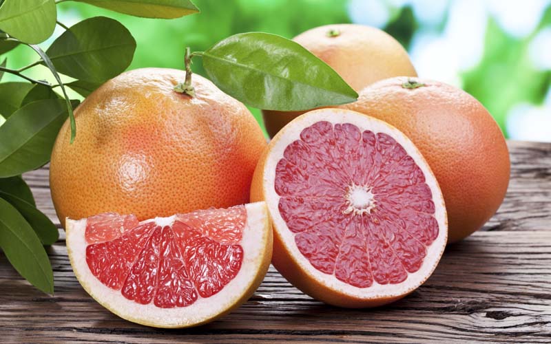 grapefruits on a wooden table.